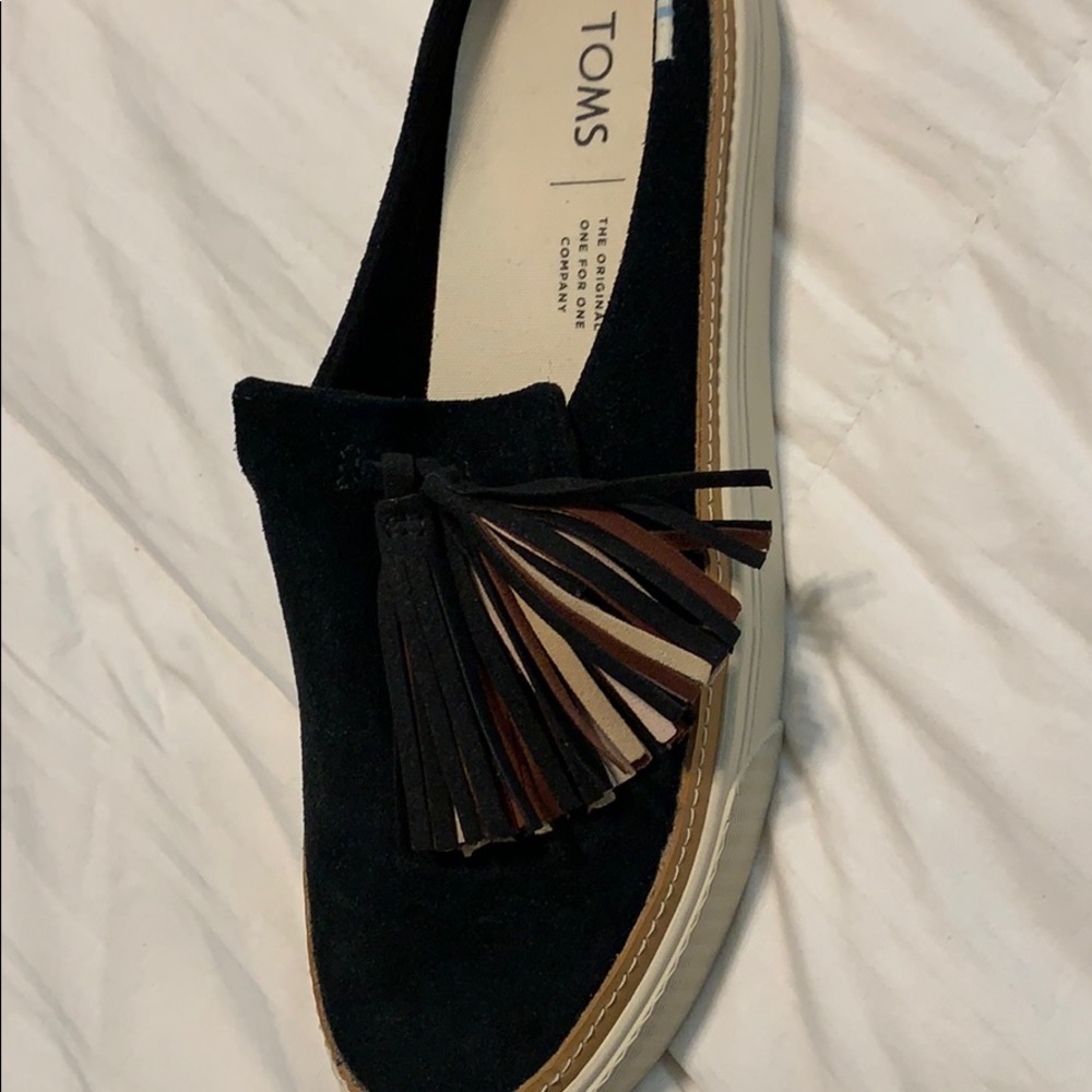 Black suede mules with tassel